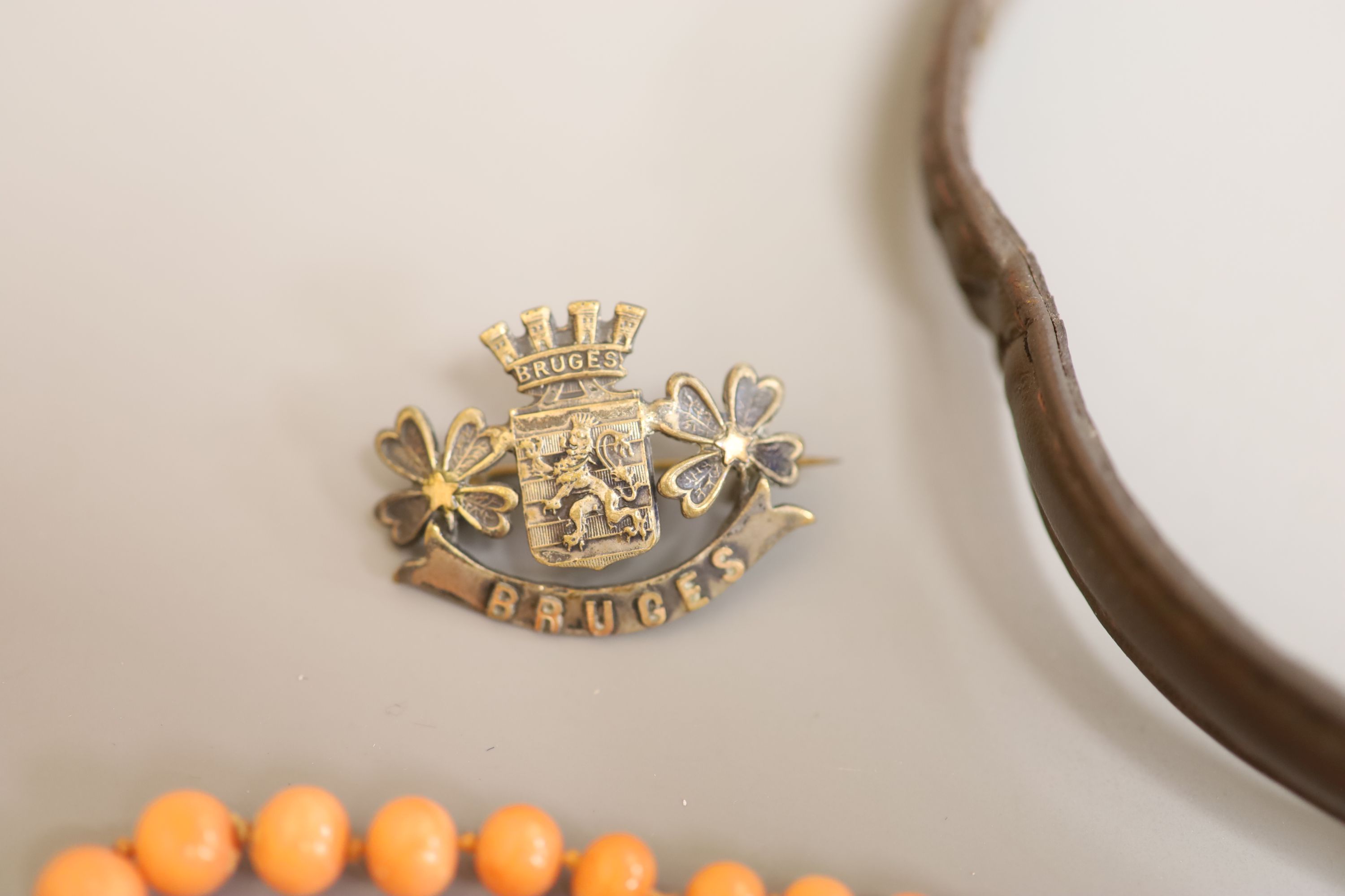 A lady's Longines gold plated and steel quartz wristwatch, one other watch, a coral bead necklace, badges etc.